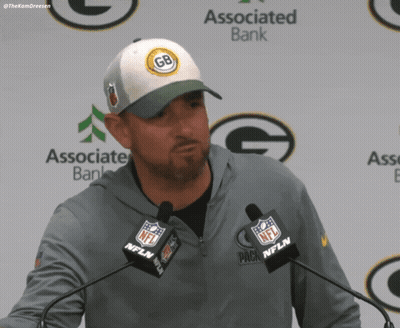 Man In Green Bay Packers Hat At Podium GIF