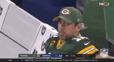 Man In Green Bay Packers Hat Sitting In Dugout At Football Game GIF