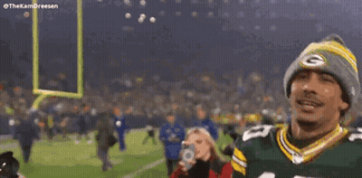 Man In Green Bay Packers Jersey And Beanie Arms In Air GIF
