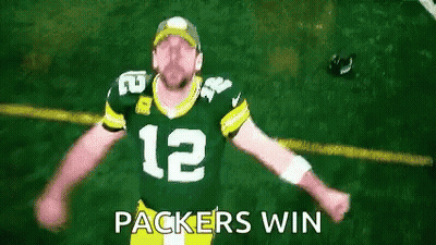 Man In Green Bay Packers Jersey Arms Outstretched Saying Packers Win GIF