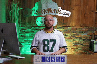 Man In Green Bay Packers Jersey In Front Of Mortgage Nerds Sign GIF
