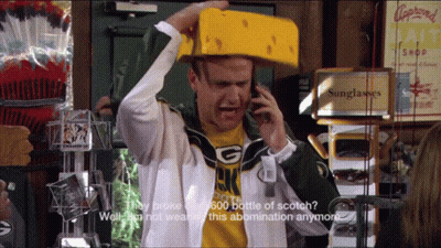 Man In Green Bay Packers Shirt Talking On Phone GIF