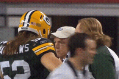 Man In Green Bay Packers Uniform Talking To Another Man GIF