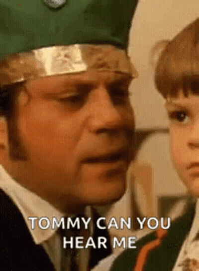 Man In Green Crown Talking To Child GIF