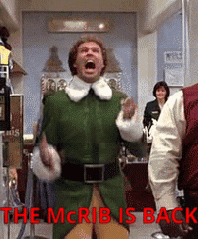 Man In Green Elf Costume Screaming The McRib Is Back GIF