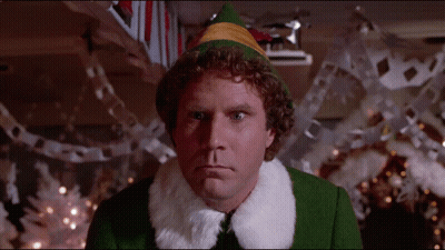 Man In Green Elf Costume With Fur Collar GIF