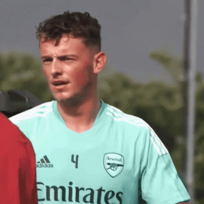 Man In Green Emirates Jersey Beside Another Man GIF