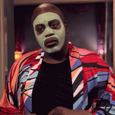 Man In Green Face Mask And Colorful Jacket GIF