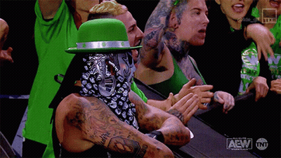 Man In Green Hat And Bandana Applauding Wrestling GIF