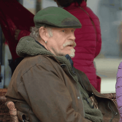 Man In Green Hat And Brown Jacket GIF