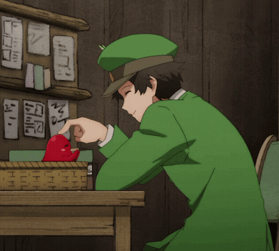 Man In Green Hat Pointing At Red Object GIF