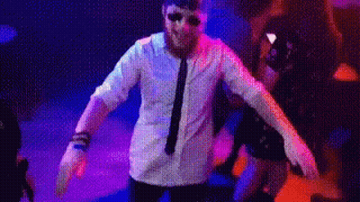 Man In Green Hat Sitting At Microphone GIF