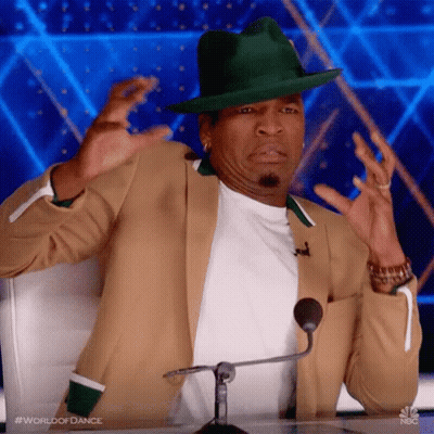 Man In Green Hat Sitting At Microphone GIF