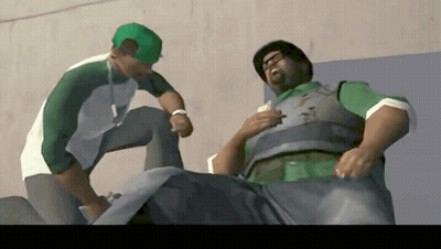 Man In Green Hat Talking To Man In Green Vest GIF