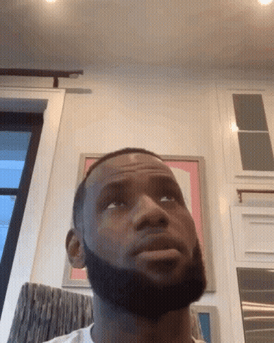 Man In Green Hat Talking To Woman In Red Tank GIF