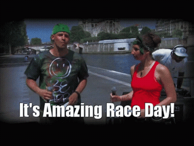 Man In Green Hat Talking To Woman In Red Tank GIF