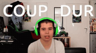 Man In Green Headphones Before Coup Dur Wall GIF