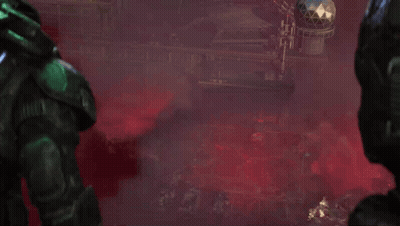 Man In Green Helmet In Front Of Red Building GIF