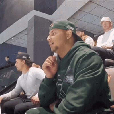 Man In Green Hoodie And Green Hat Saying Aarons GIF