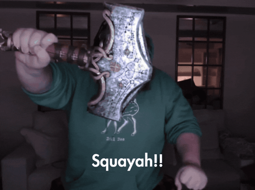 Man In Green Hoodie Holding Axe GIF