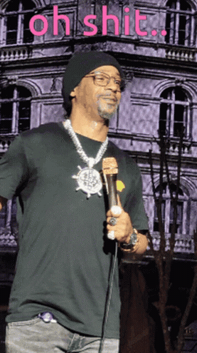 Man In Green Jacket And Tie At Microphone GIF