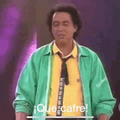 Man In Green Jacket And Tie Eyes Closed At Microphone GIF