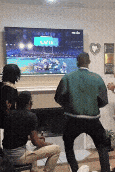 Man in Green Jacket Dancing NFL TV