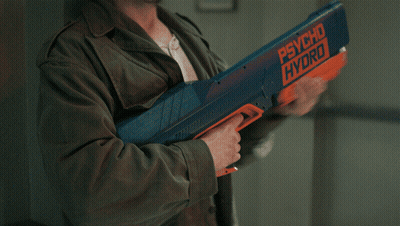 Man In Green Jacket Holding Psycho Hydro Water Gun GIF