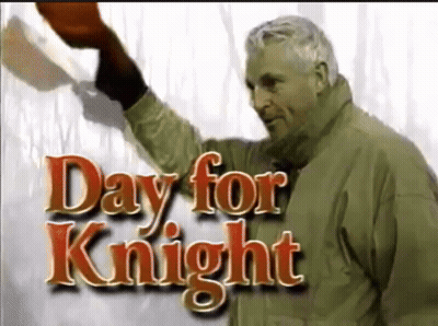 Man In Green Jacket Holding Red Hat Day For Knight GIF