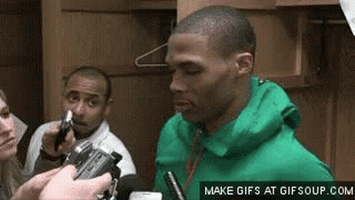Man In Green Jacket Interviewed By Reporter In Locker Room GIF
