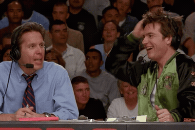 Man In Green Jacket Laughing With Another Man GIF