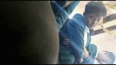 Man In Green Jacket Lying On Floor Eyes Closed GIF