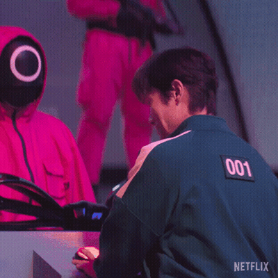 Man In Green Jacket Number 001 Giving OK Sign GIF