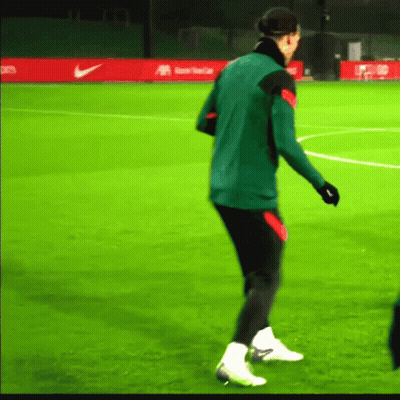 Man In Green Jacket On Green Soccer Field GIF
