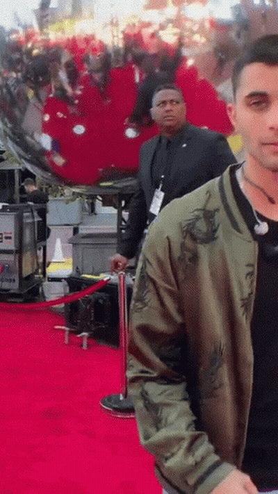 Man In Green Jacket On Red Carpet GIF