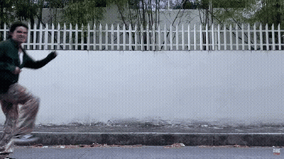 Man In Green Jacket Running GIF