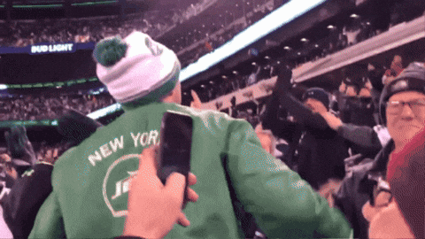 Man in Green Jacket Saying New York