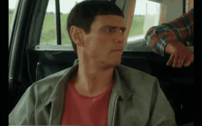 Man in Green Jacket Sitting in Back Seat