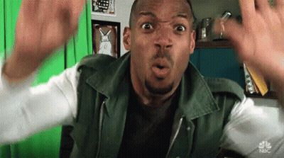 Man In Green Jacket Surprised In Front Of Green Screen GIF