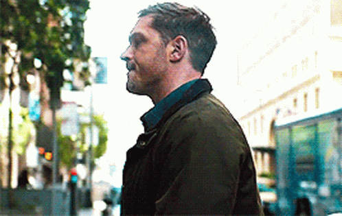 Man In Green Jacket Walking GIF