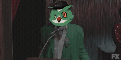 Man In Green Jacket With Owl On Head Says Goodnight GIF