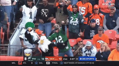 Man In Green Jersey Number 12 In Front Of Crowd GIF