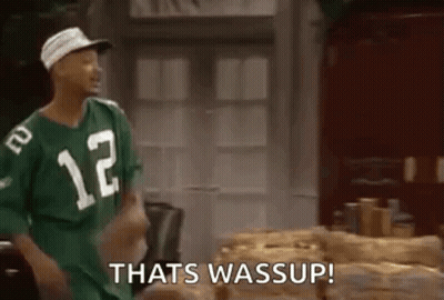 Man In Green Jersey Number 12 Next To Logs GIF