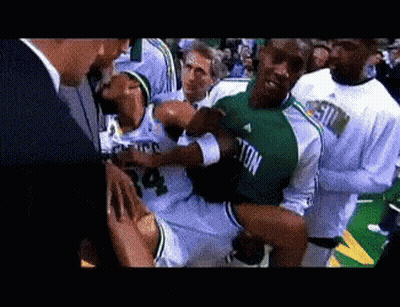 Man In Green Jersey Number 4 Being Carried GIF