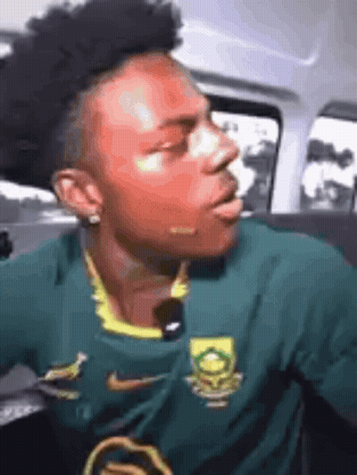 Man In Green Nike Jersey Sitting In Car GIF