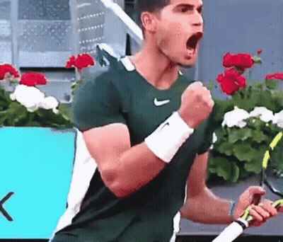 Man In Green Nike Shirt Celebrating Tennis Racquet GIF