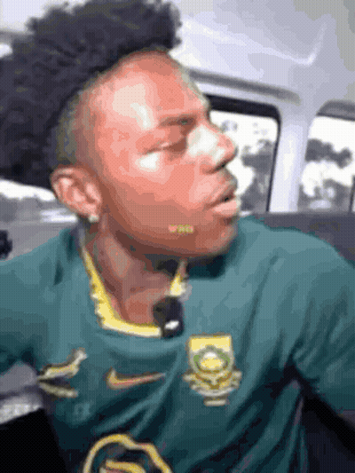 Man In Green Nike Shirt Sitting In Back Seat Of Car GIF