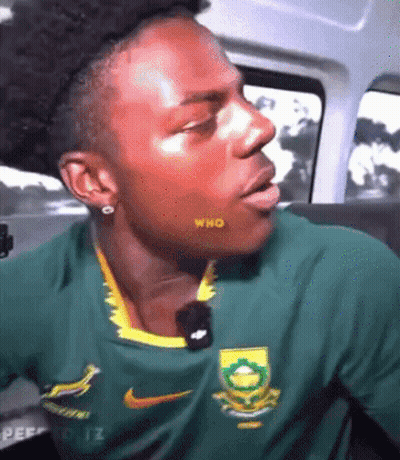 Man In Green Nike Shirt Sitting In Car With Mouth Open GIF