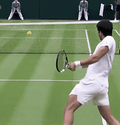 Man In Green Nike Shirt Walking Through Crowd GIF