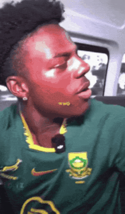 Man In Green Nike Shirt With Yellow Logo GIF